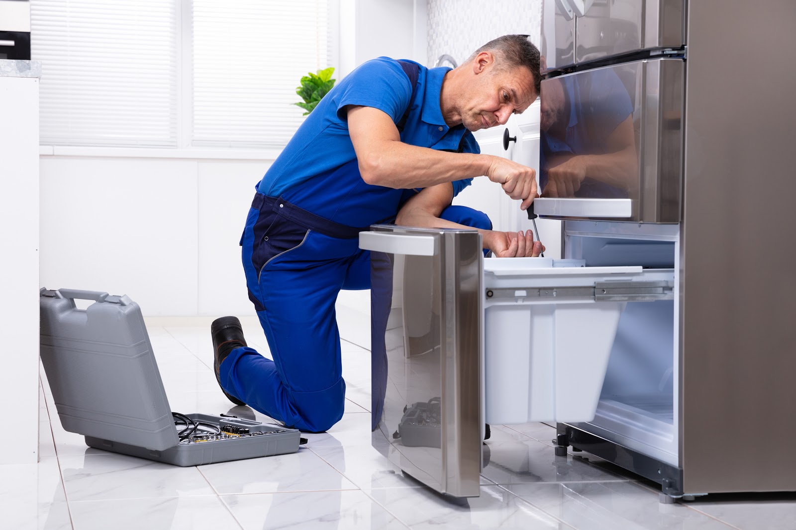 Appliance technician at work